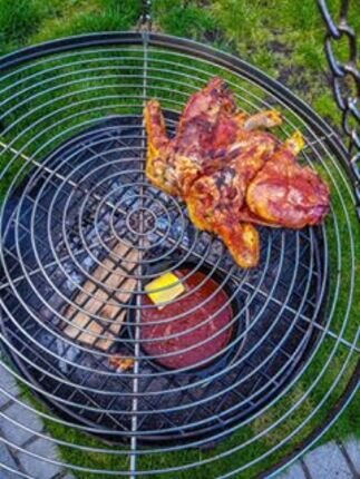 Cooking chicken on our hanging grill and tripod